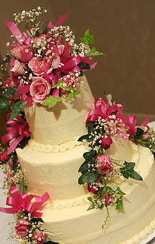 Cake flowers, reception flowers, and wedding tables centerpieces from your Wilmington, Ohio (OH) florist. 